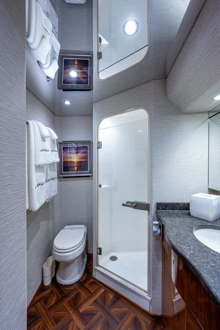 a bathroom with a toilet and sink aboard GYPSEA Yacht for Sale
