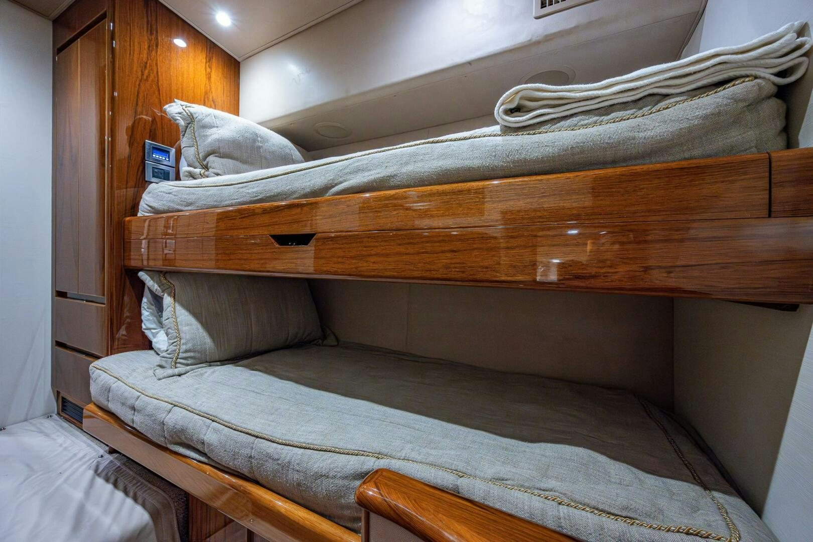 a bed with a wooden frame aboard GYPSEA Yacht for Sale