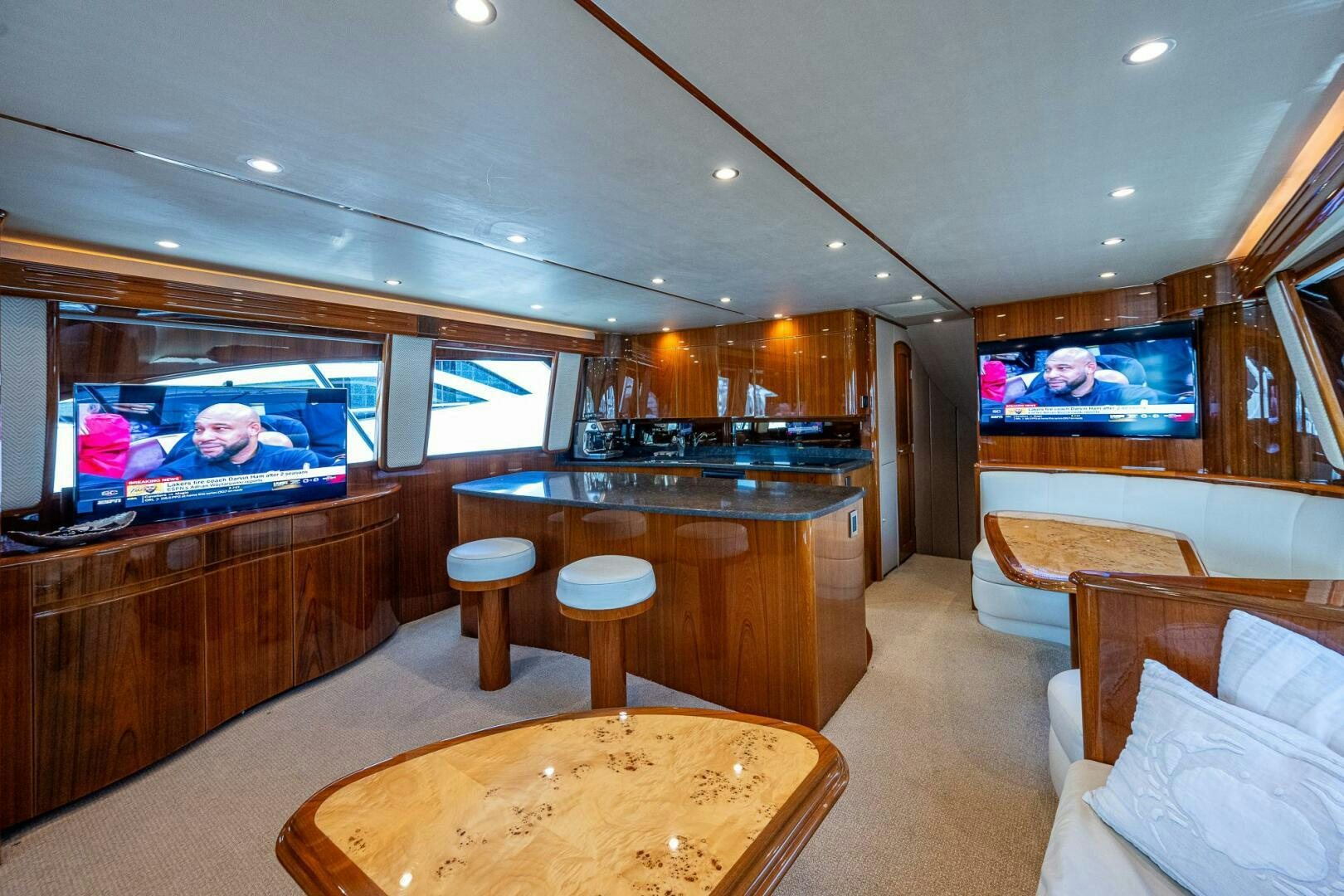 a large living room with a large bar and a large television aboard GYPSEA Yacht for Sale