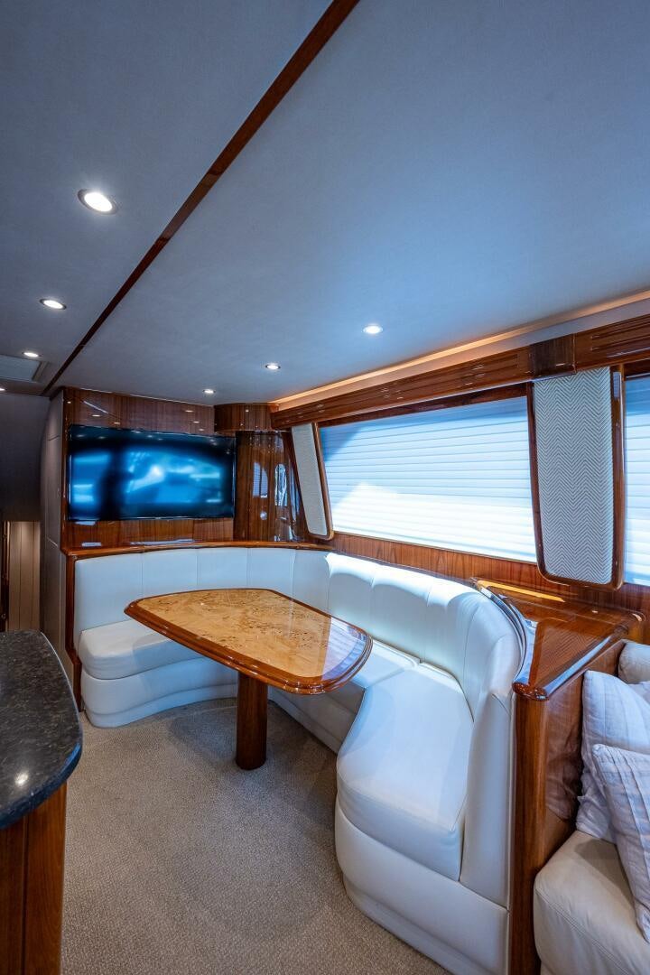 a room with a table and chairs aboard GYPSEA Yacht for Sale