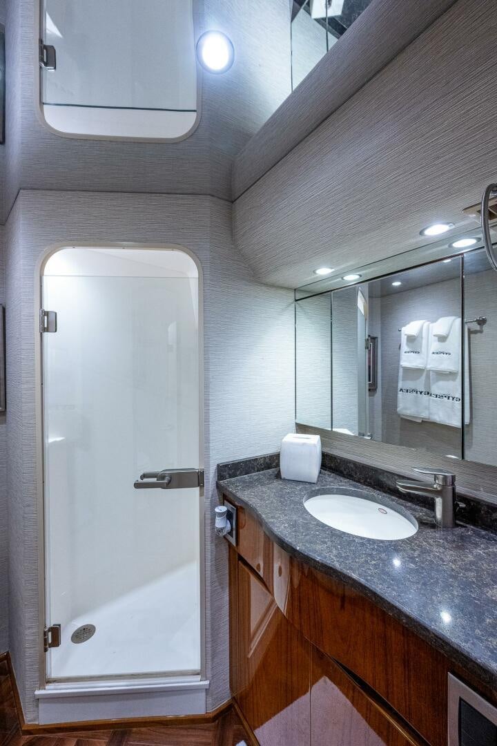 a bathroom with a large mirror aboard GYPSEA Yacht for Sale