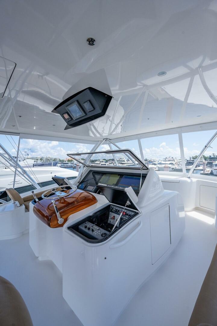 a white car with a black screen and a white car with a white interior aboard GYPSEA Yacht for Sale