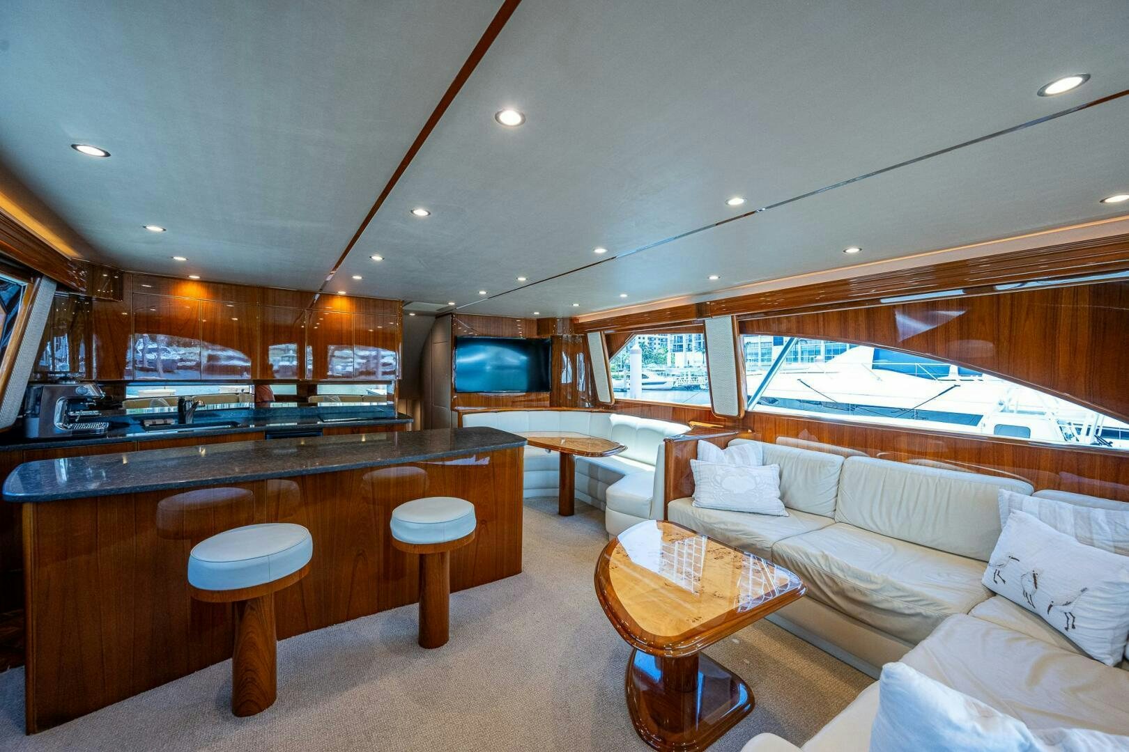 a large living room with a bar and a bar aboard GYPSEA Yacht for Sale
