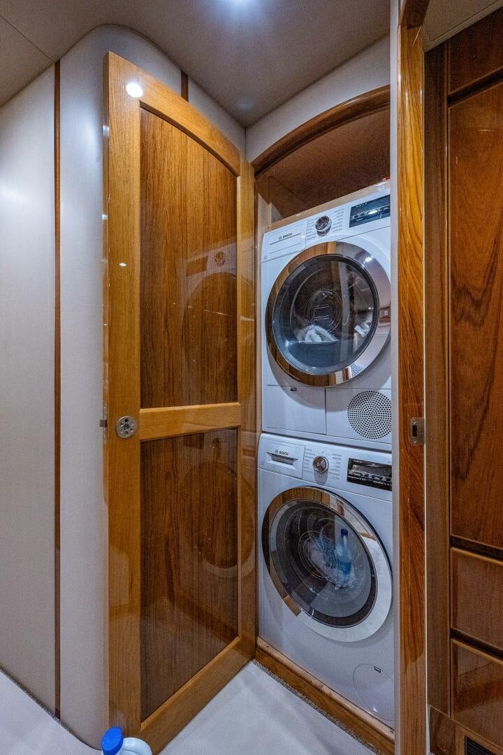 a dryer and dryer in a room aboard GYPSEA Yacht for Sale