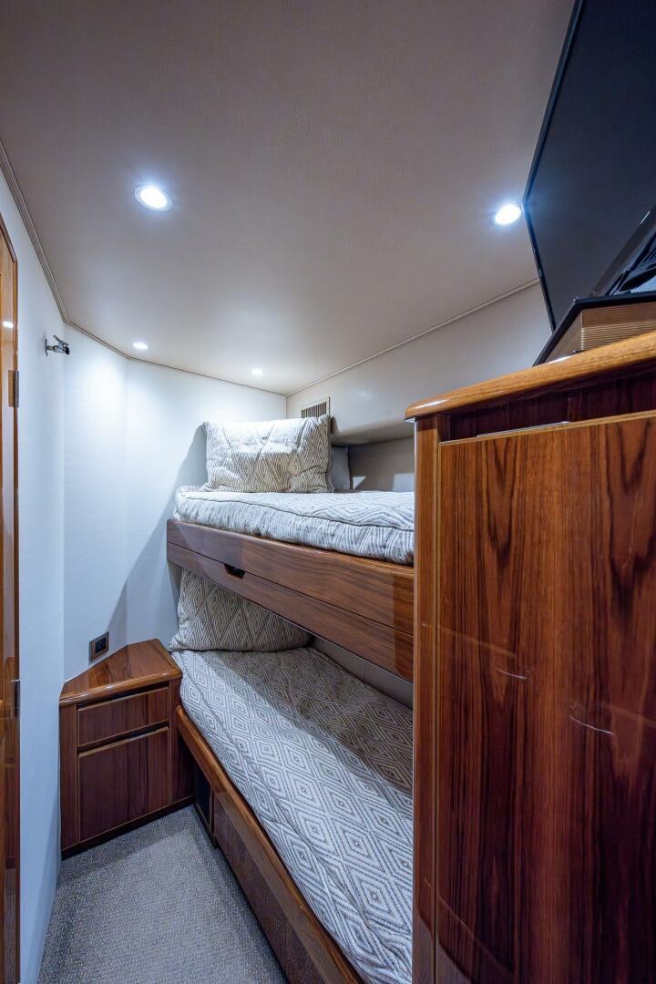 a bedroom with two beds aboard GYPSEA Yacht for Sale