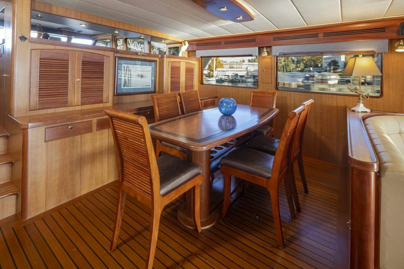 a wood table in a room aboard HYJAC Yacht for Sale
