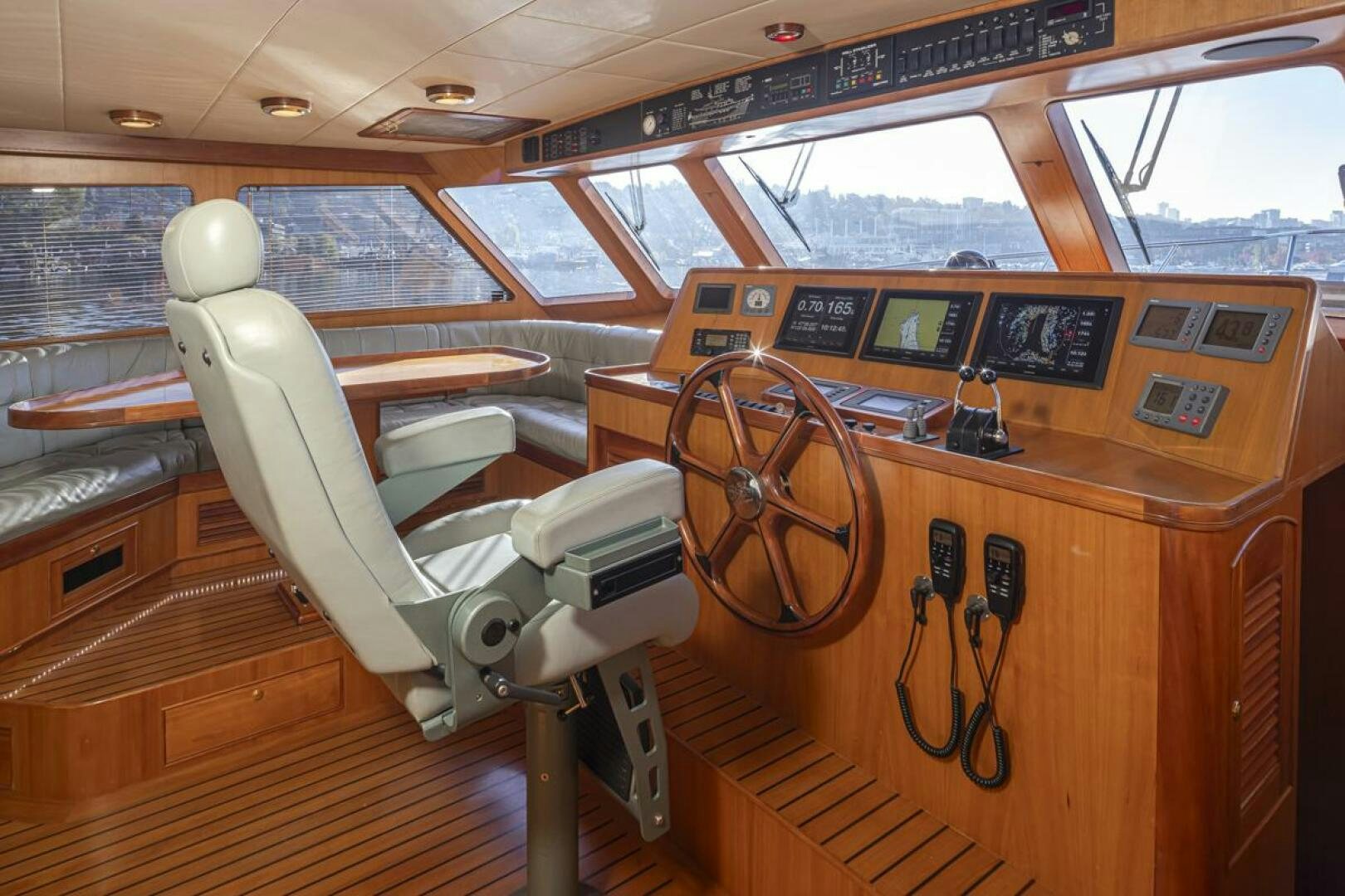 a wooden boat with a steering wheel aboard HYJAC Yacht for Sale