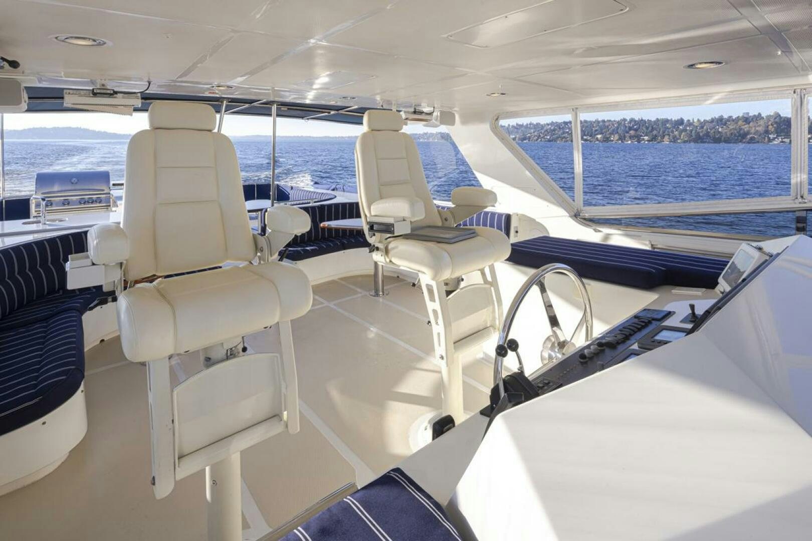 a boat with chairs on it aboard HYJAC Yacht for Sale