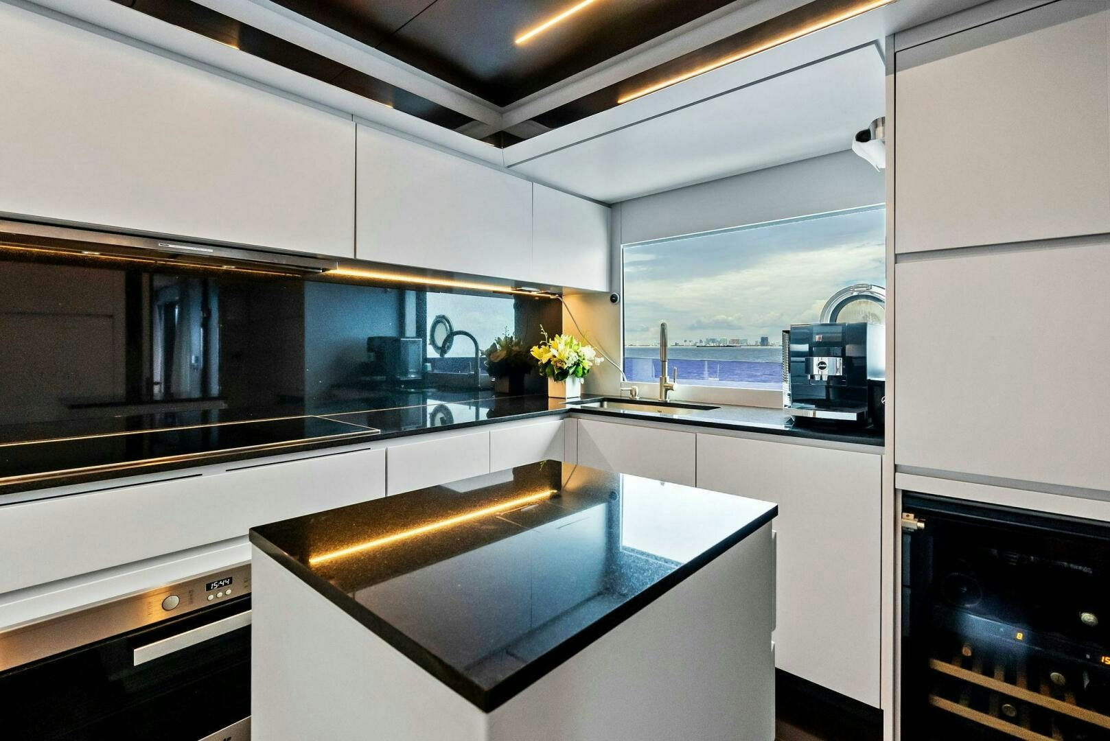 a kitchen with a sink and cabinets aboard NO SURRENDER Yacht for Sale