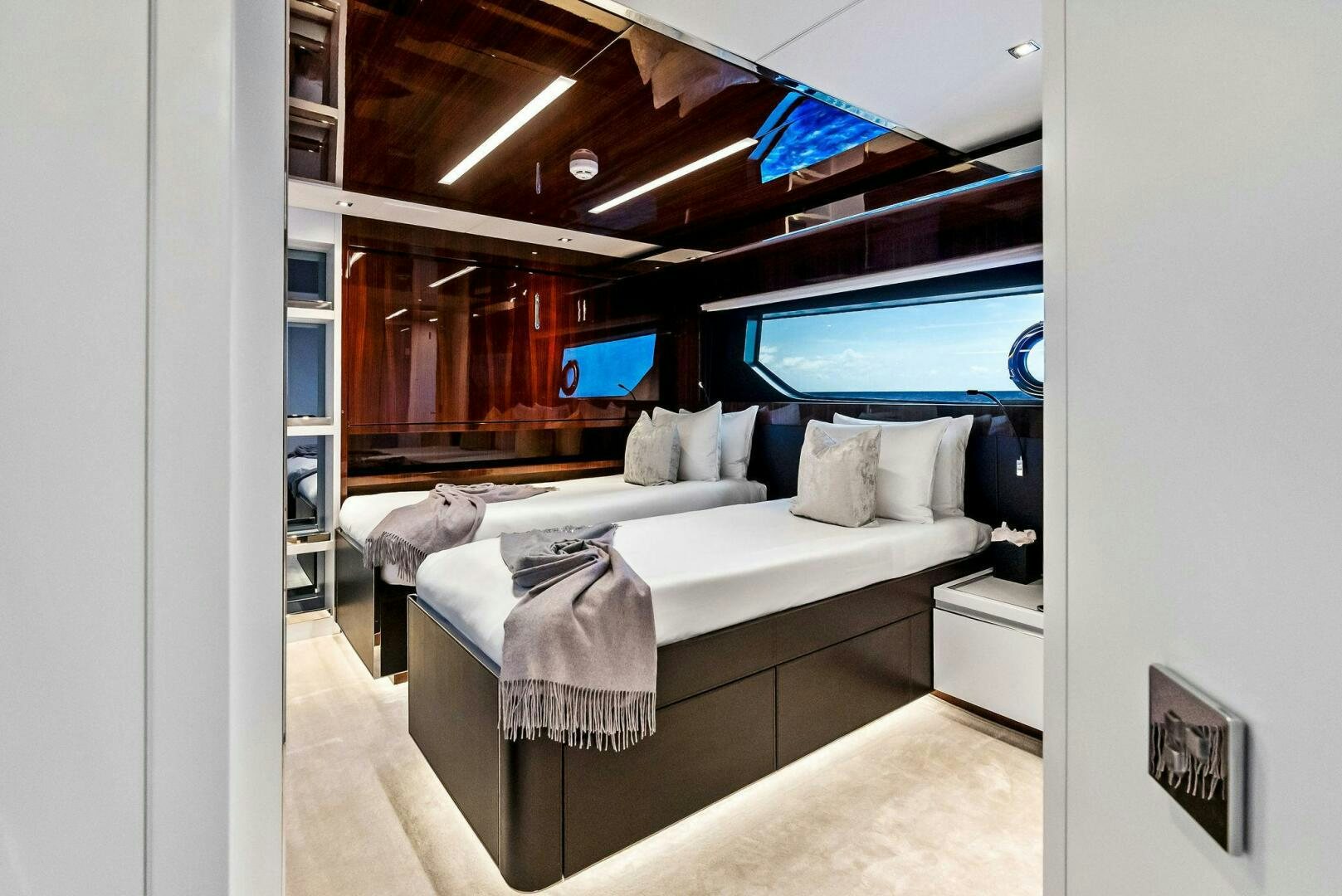 a room with a bed and a television aboard NO SURRENDER Yacht for Sale
