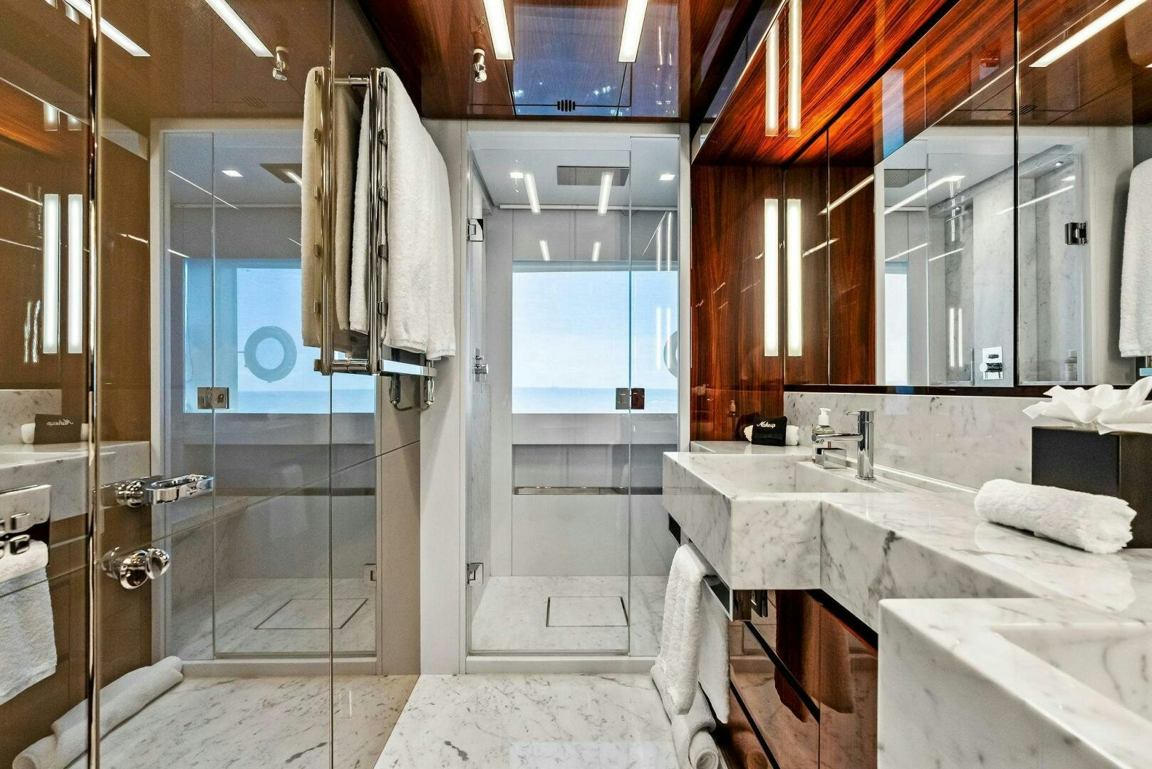 a bathroom with a large mirror aboard NO SURRENDER Yacht for Sale