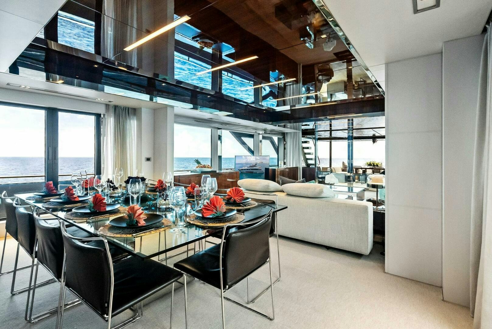 a room with a table and chairs aboard NO SURRENDER Yacht for Sale