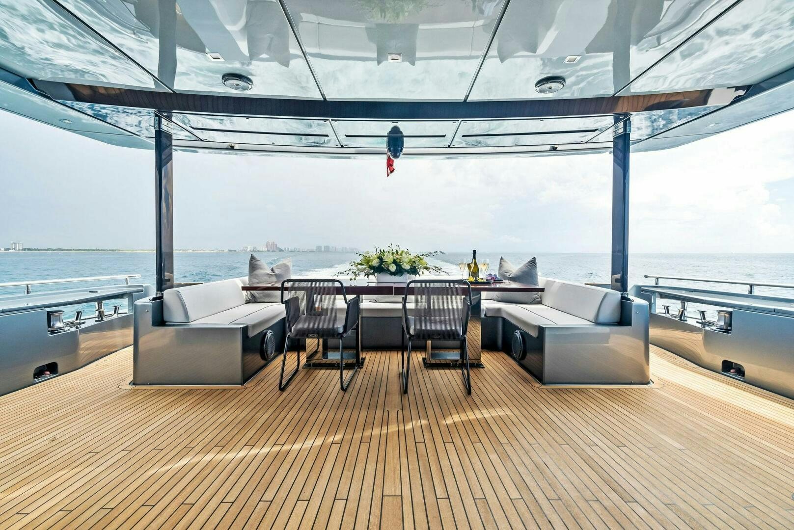 a room with a table and chairs aboard NO SURRENDER Yacht for Sale