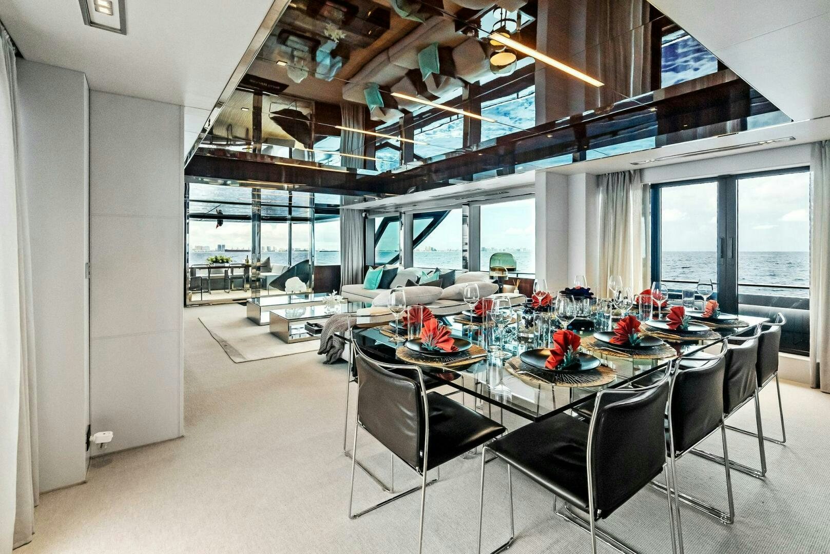 a room with a table and chairs aboard NO SURRENDER Yacht for Sale