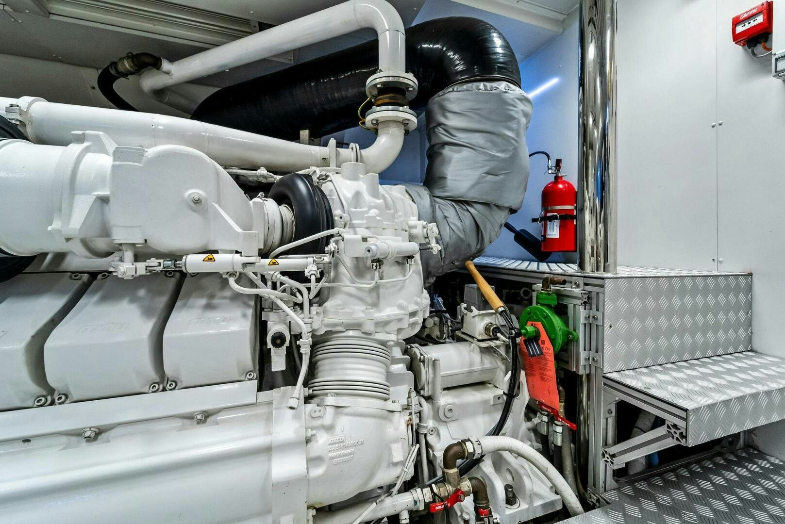 a person working on a machine aboard NO SURRENDER Yacht for Sale