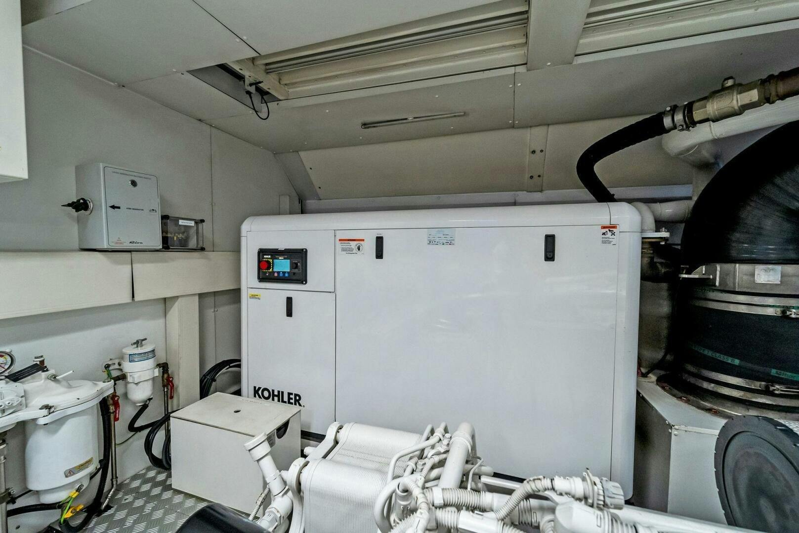 a white refrigerator in a room aboard NO SURRENDER Yacht for Sale