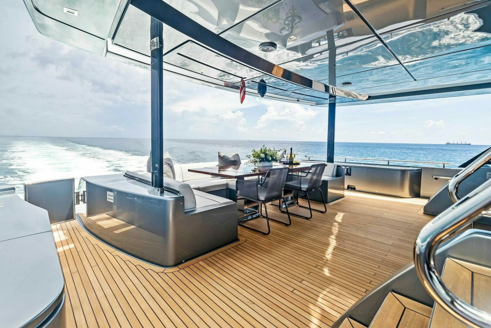 a room with a table and chairs aboard NO SURRENDER Yacht for Sale