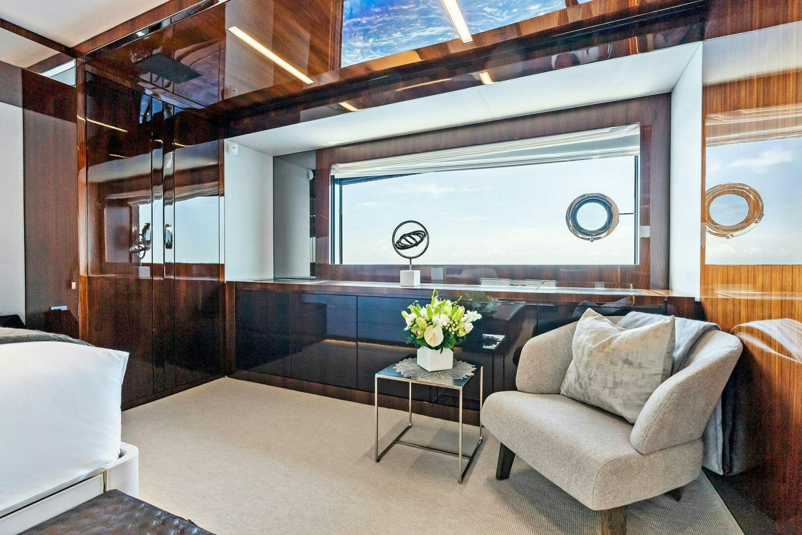 a room with a couch and a table aboard NO SURRENDER Yacht for Sale
