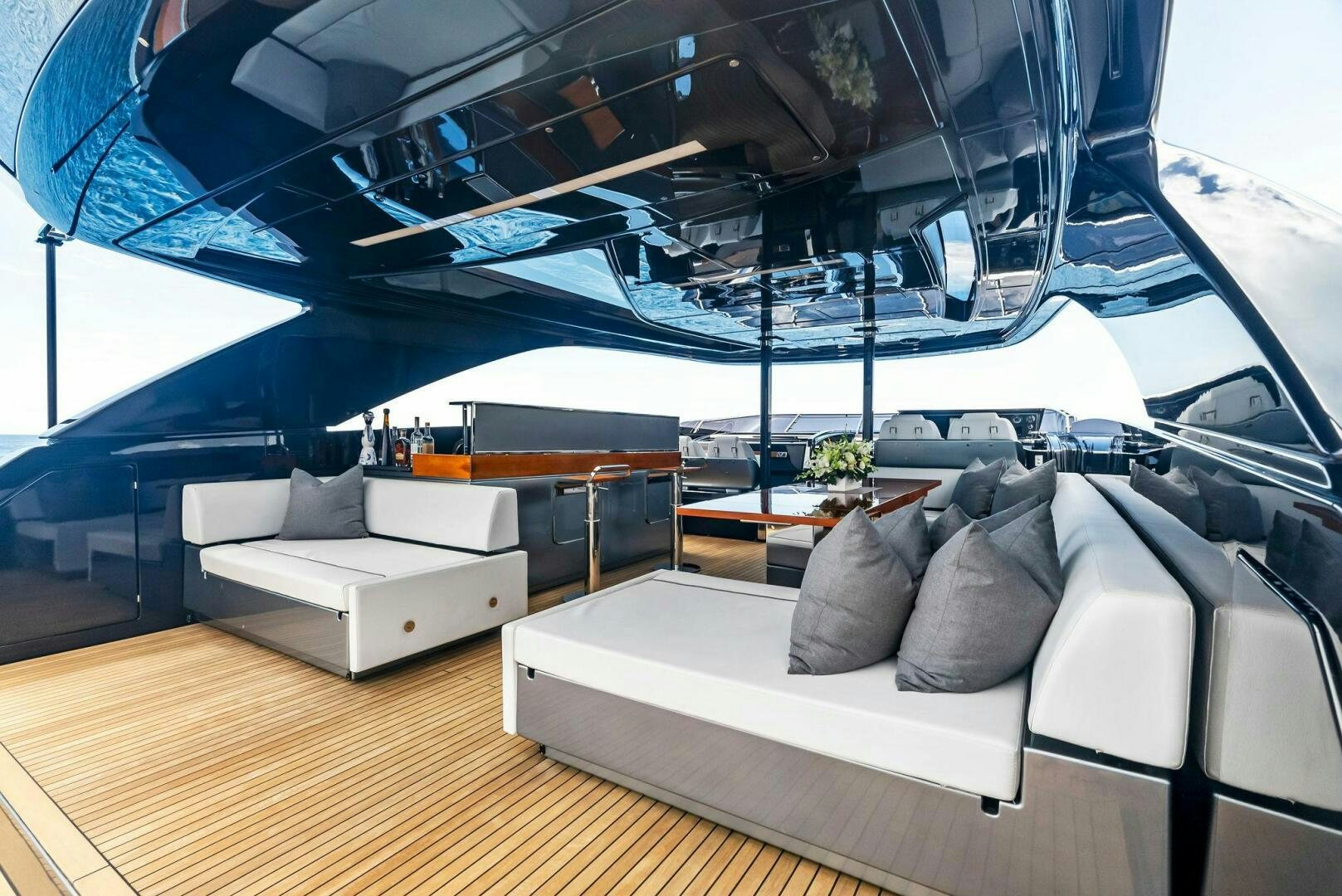 a room with a couch and a table aboard NO SURRENDER Yacht for Sale