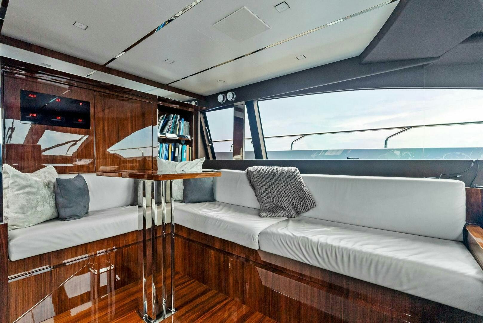 a boat with a couch and a table aboard NO SURRENDER Yacht for Sale
