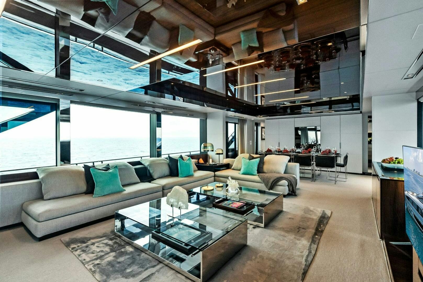 a living room with a large window aboard NO SURRENDER Yacht for Sale