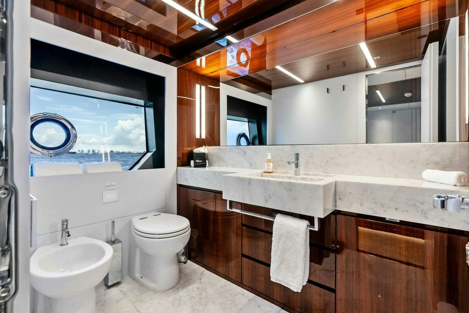 a bathroom with a large window aboard NO SURRENDER Yacht for Sale
