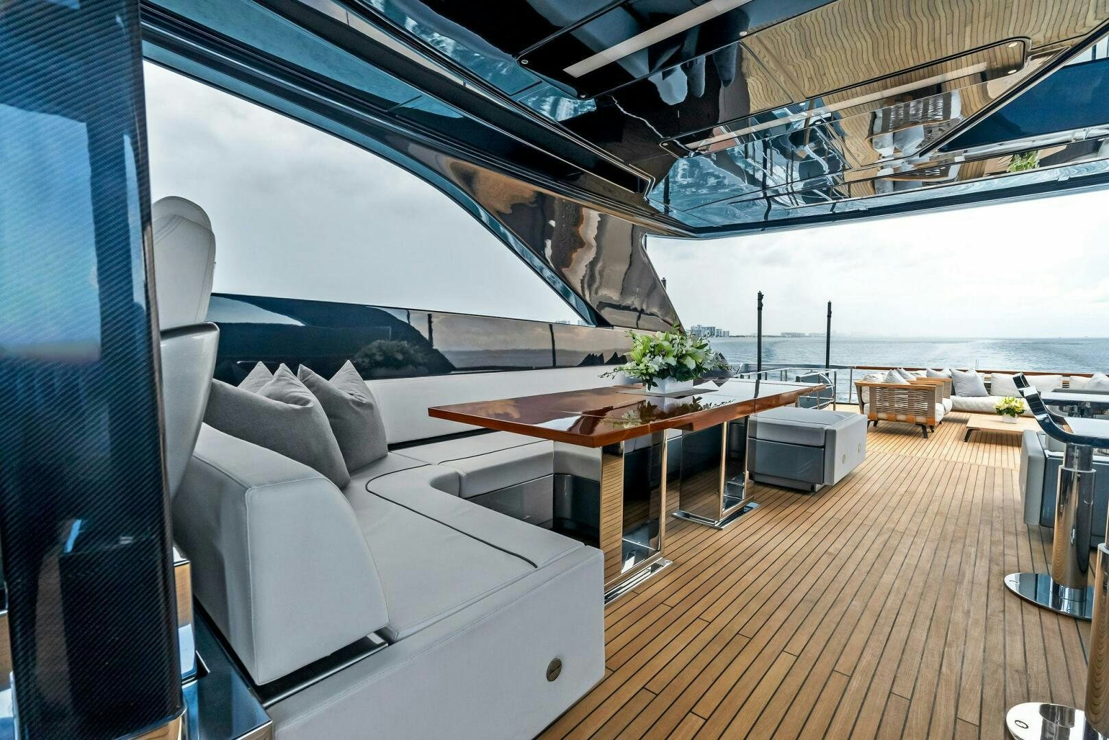 a room with a couch and a table aboard NO SURRENDER Yacht for Sale