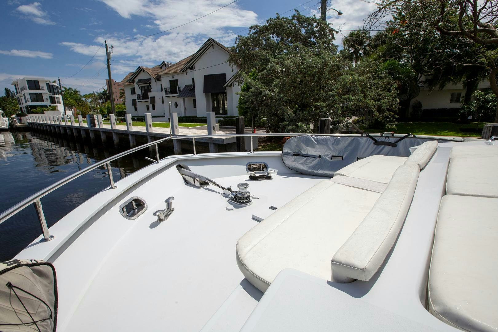 a white boat on a body of water aboard PAINKILLER Yacht for Sale