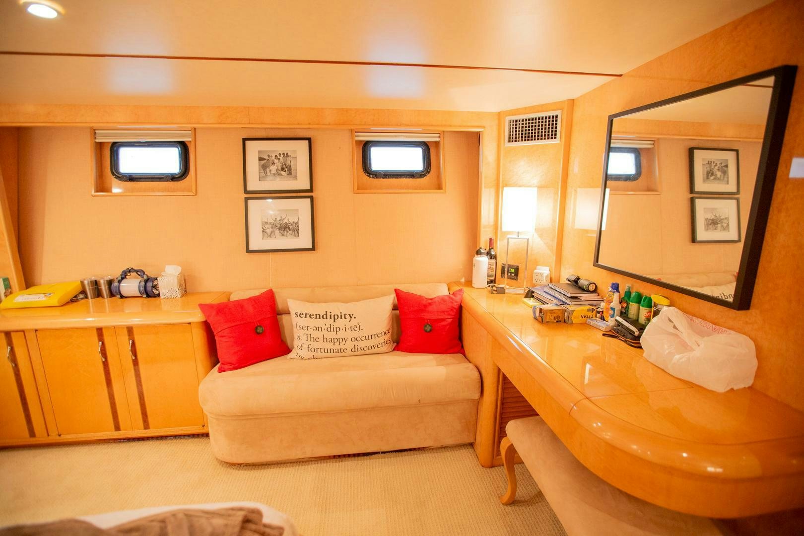 a living room with a couch and a table aboard PAINKILLER Yacht for Sale