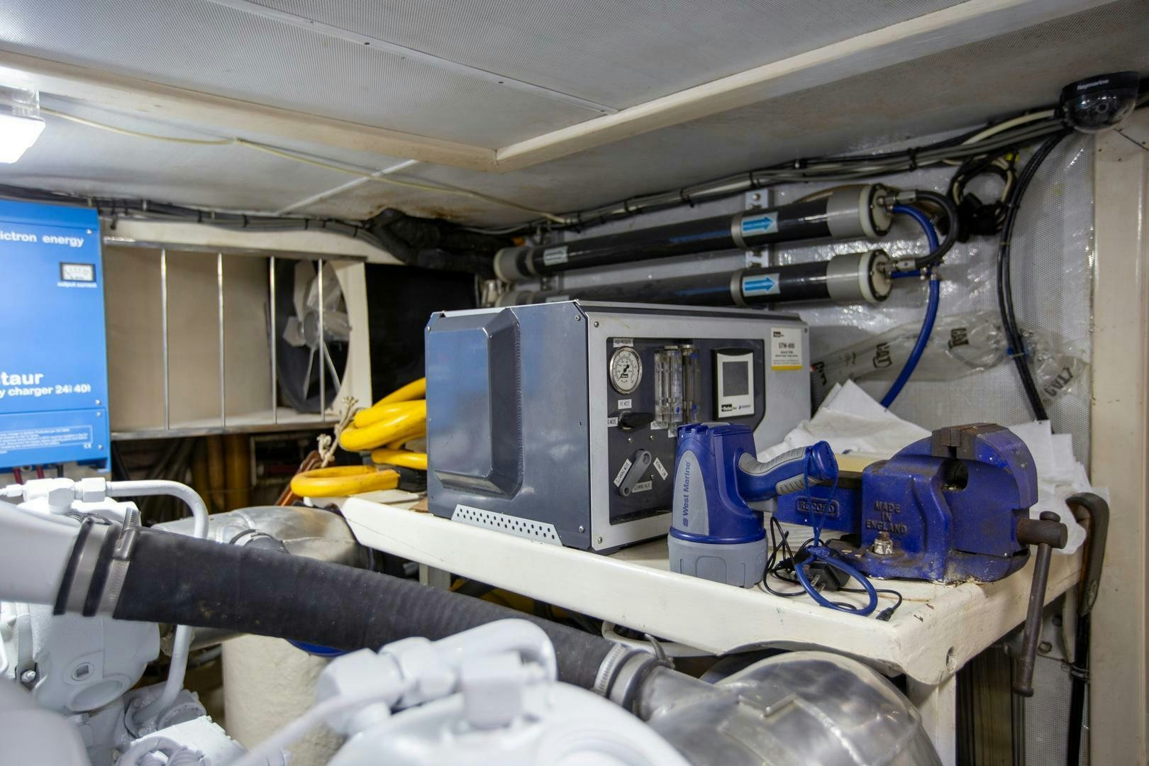 a machine with blue pipes aboard PAINKILLER Yacht for Sale