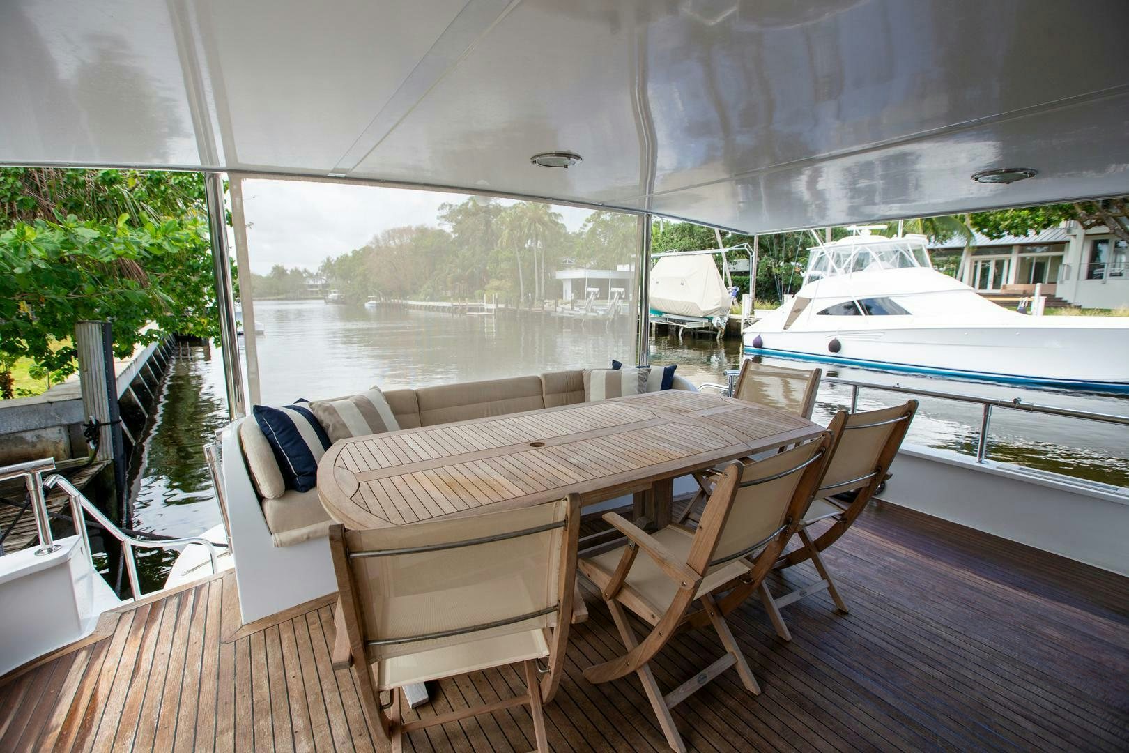 a table and chairs on a deck aboard PAINKILLER Yacht for Sale