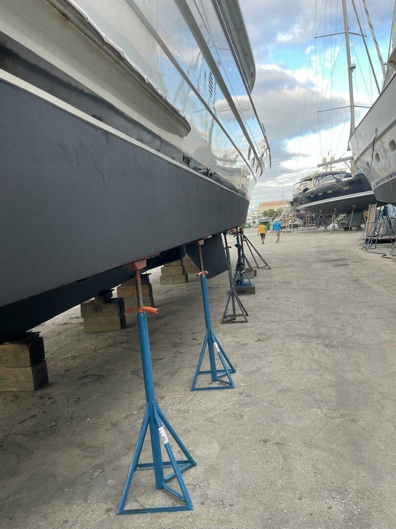 a boat on the sand aboard PAINKILLER Yacht for Sale