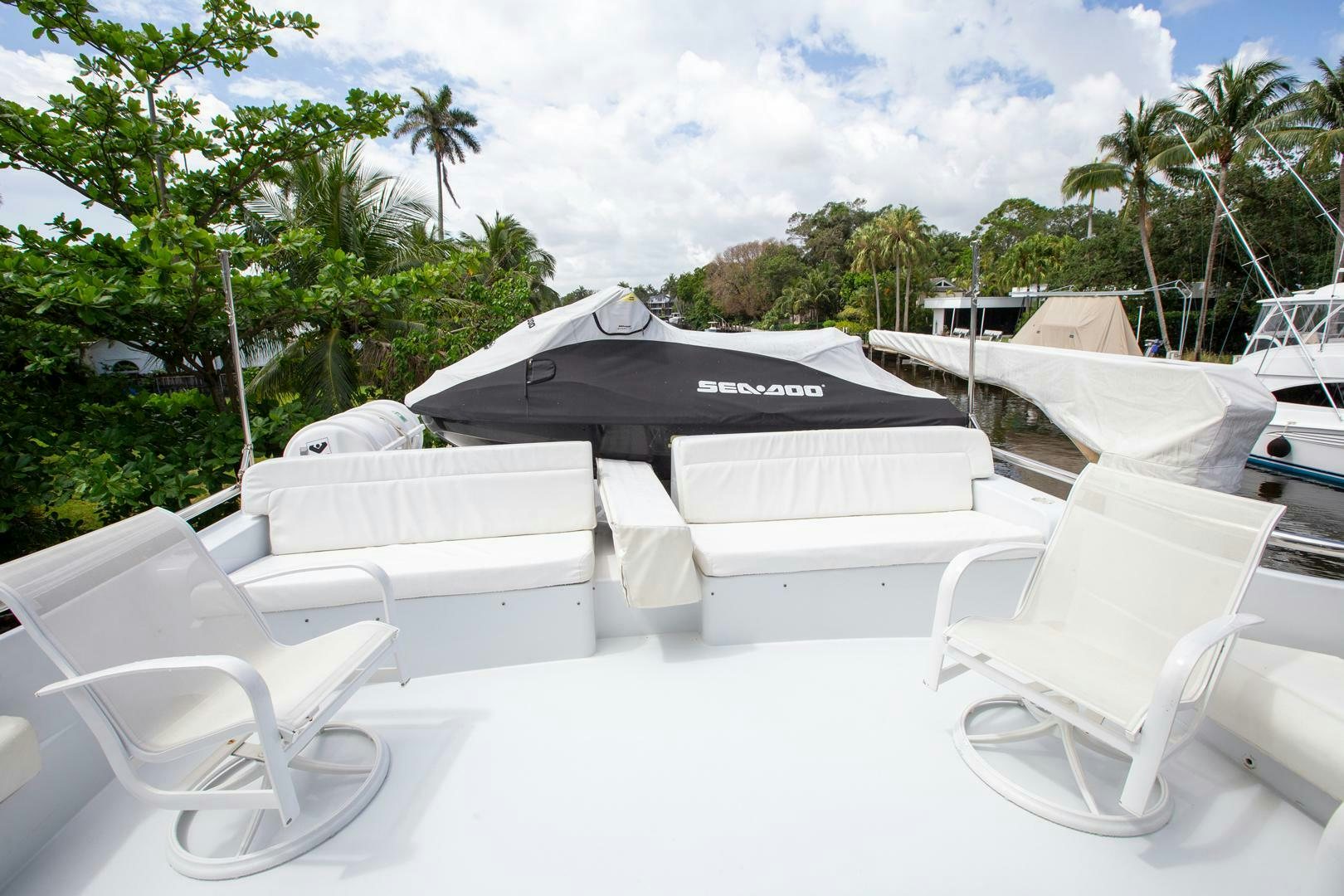 a group of chairs outside aboard PAINKILLER Yacht for Sale