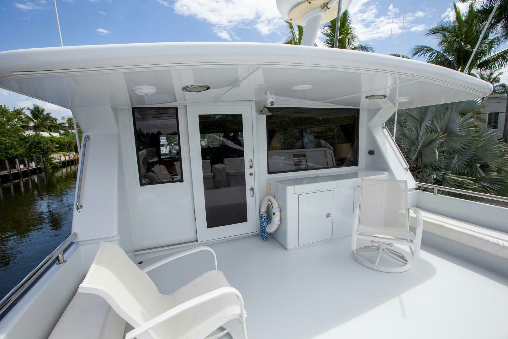 a white house with a pool aboard PAINKILLER Yacht for Sale