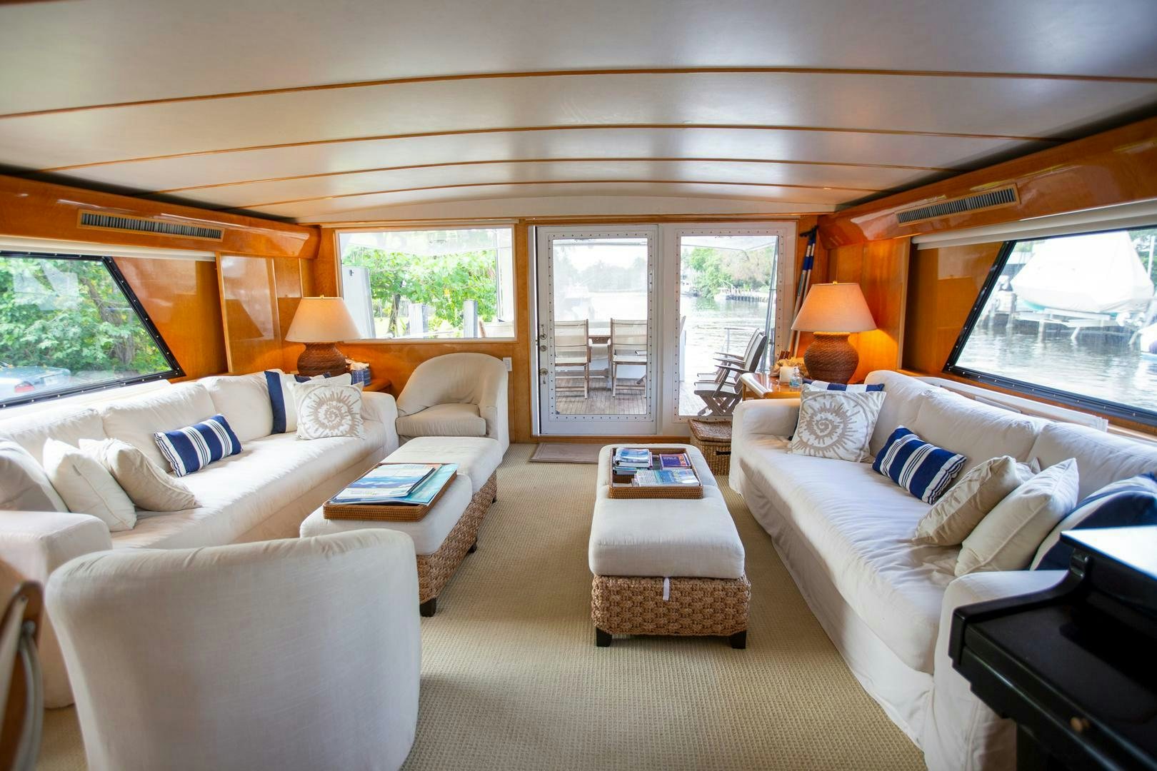 a living room with a large window aboard PAINKILLER Yacht for Sale