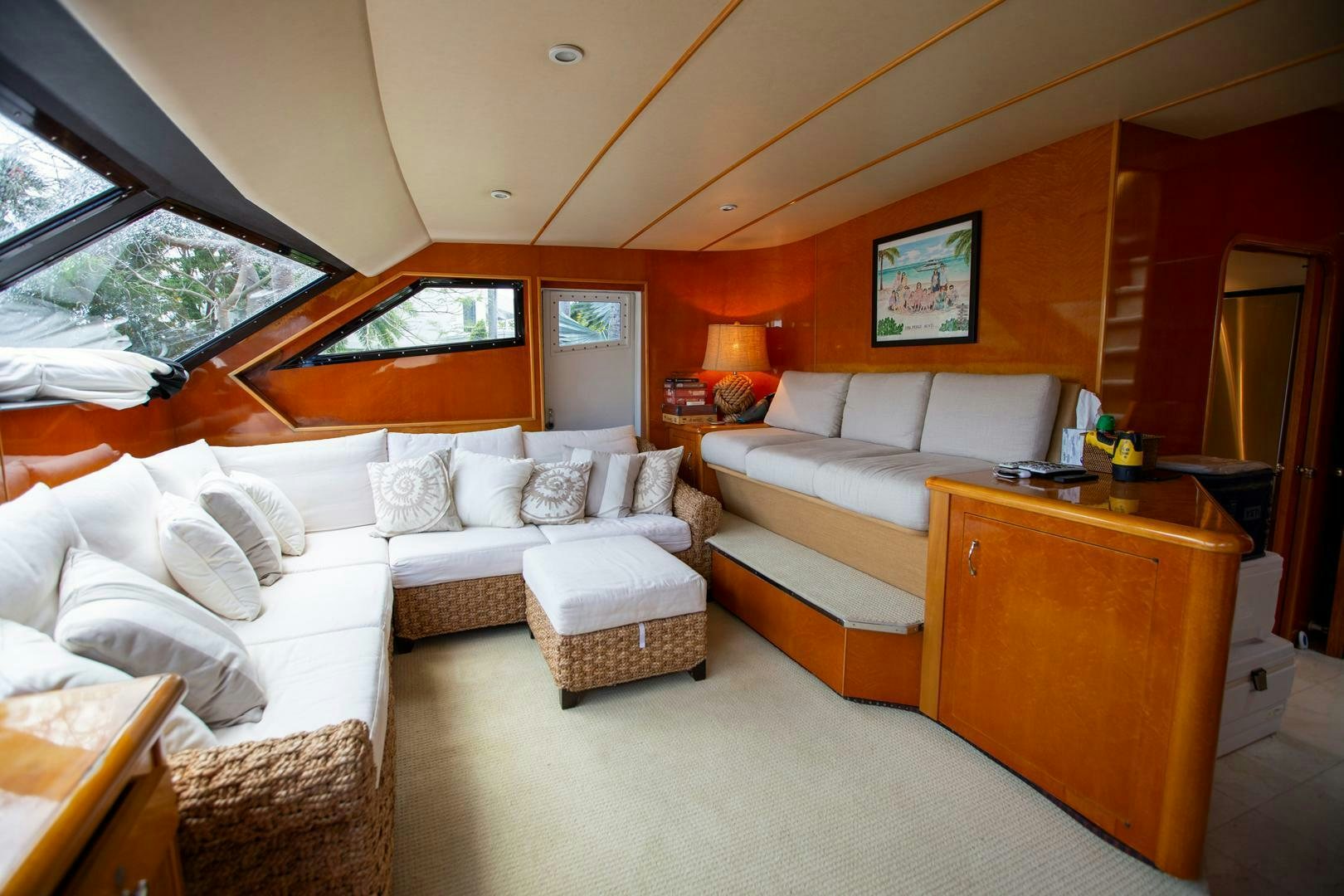 a living room with a couch and a table aboard PAINKILLER Yacht for Sale