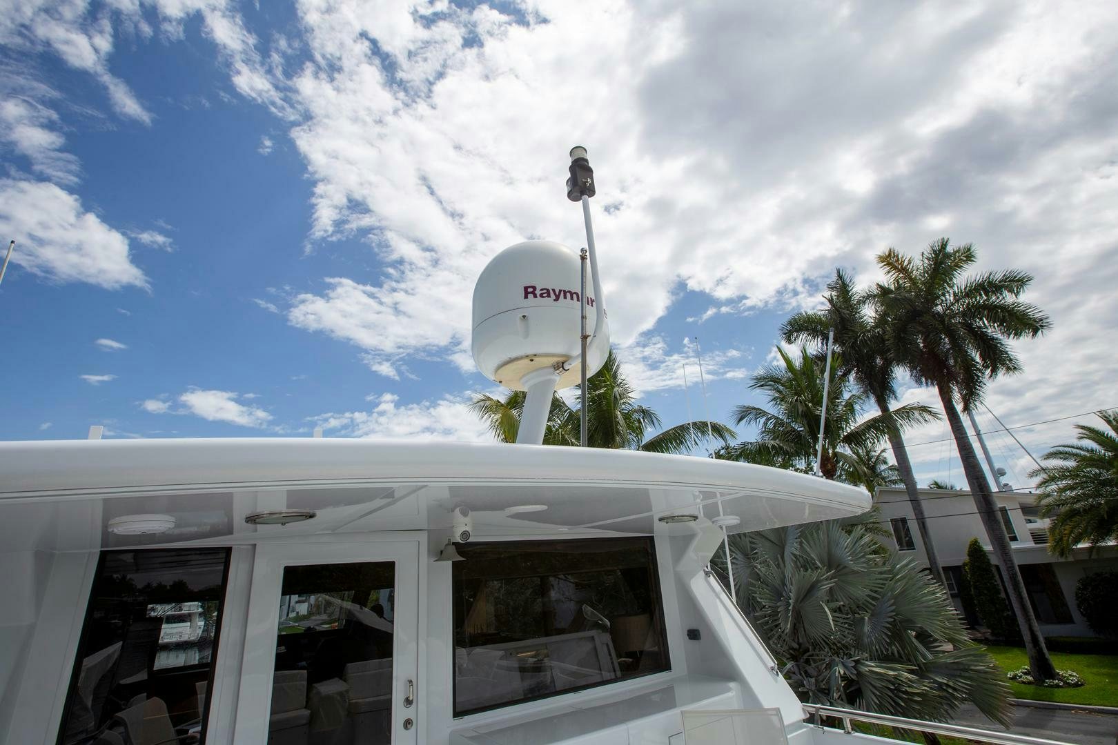 a white building with a water tower aboard PAINKILLER Yacht for Sale