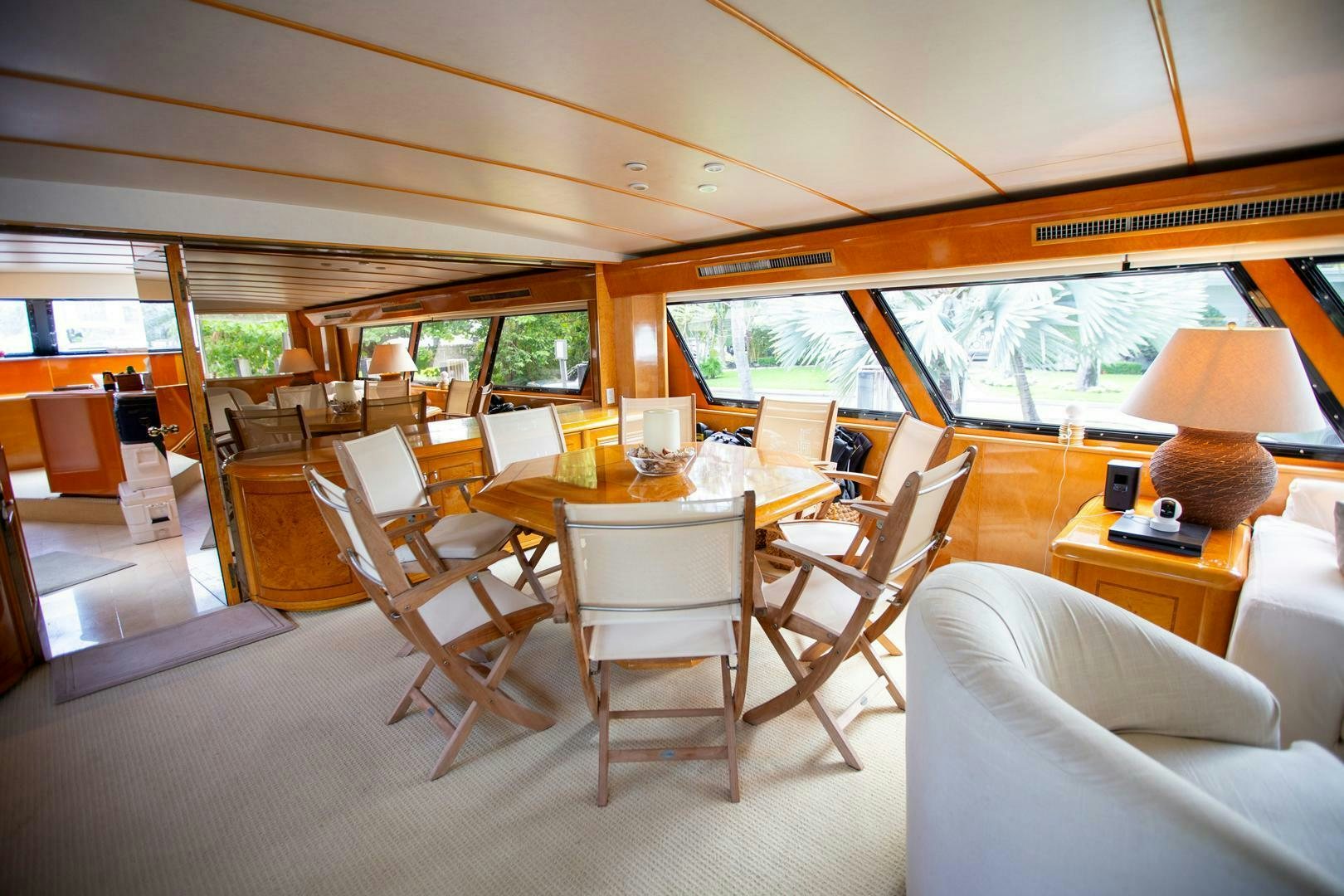 a room with tables and chairs aboard PAINKILLER Yacht for Sale
