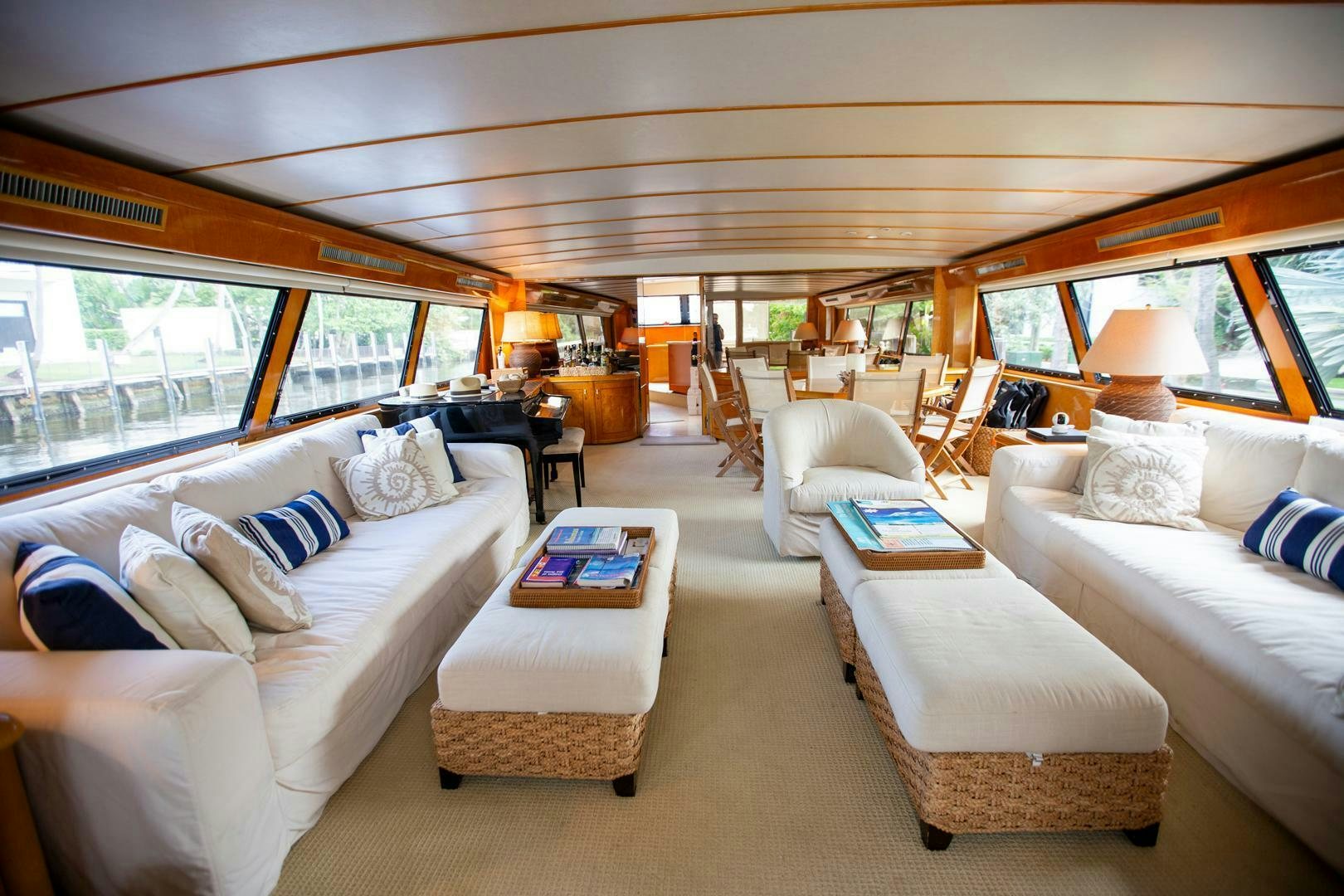 a living room with a large window aboard PAINKILLER Yacht for Sale