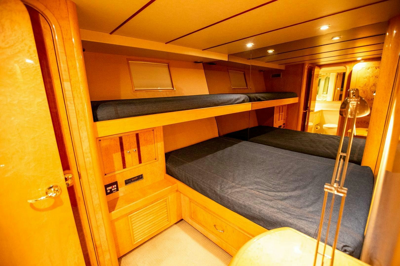 a bed in a room aboard PAINKILLER Yacht for Sale