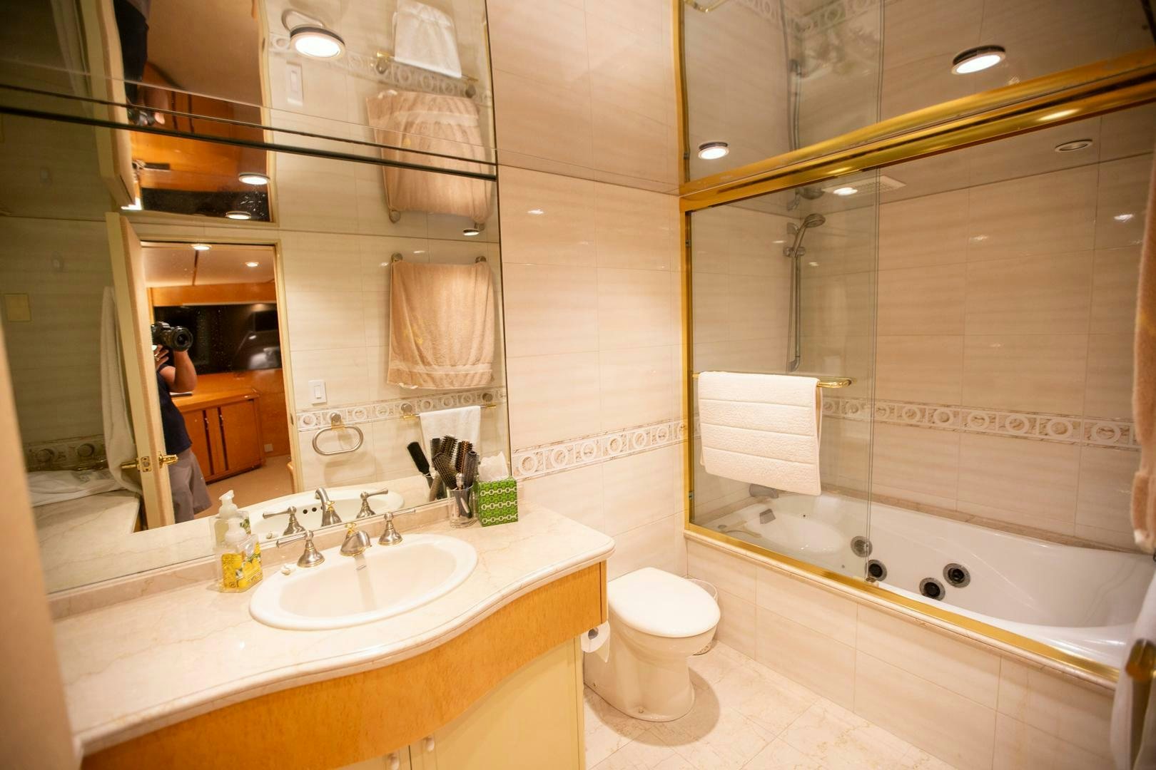 a bathroom with a large mirror aboard PAINKILLER Yacht for Sale