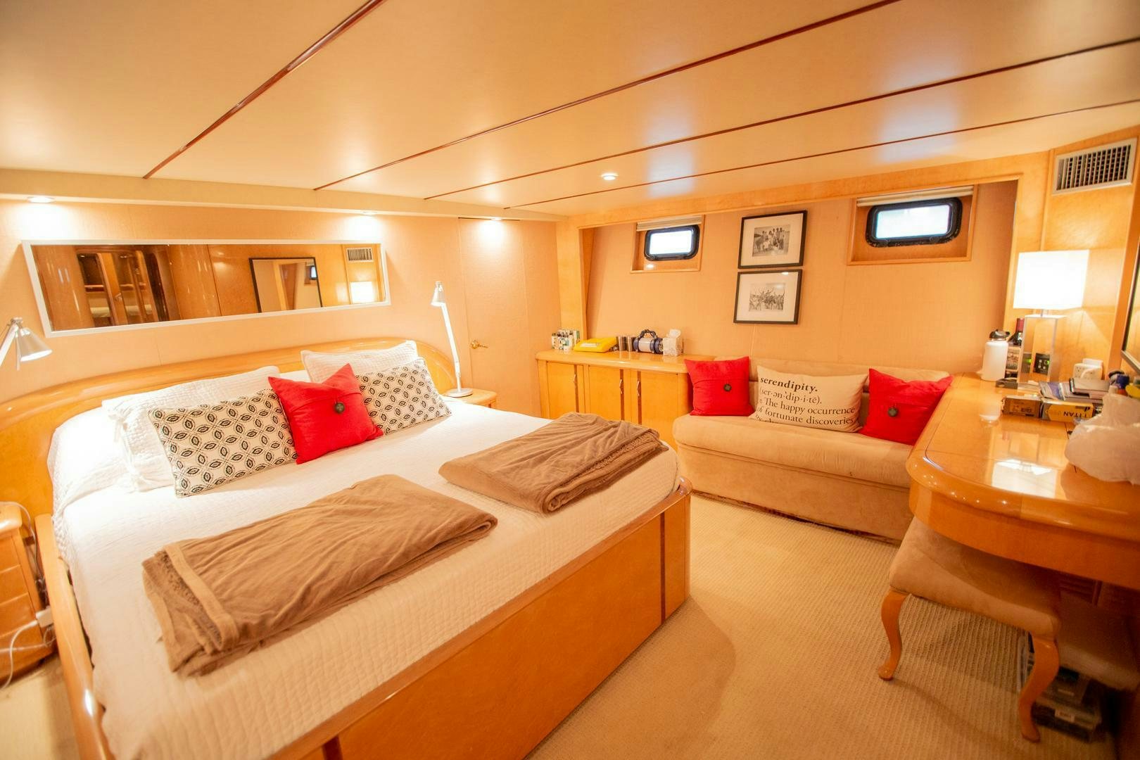 a room with a bed and a couch aboard PAINKILLER Yacht for Sale