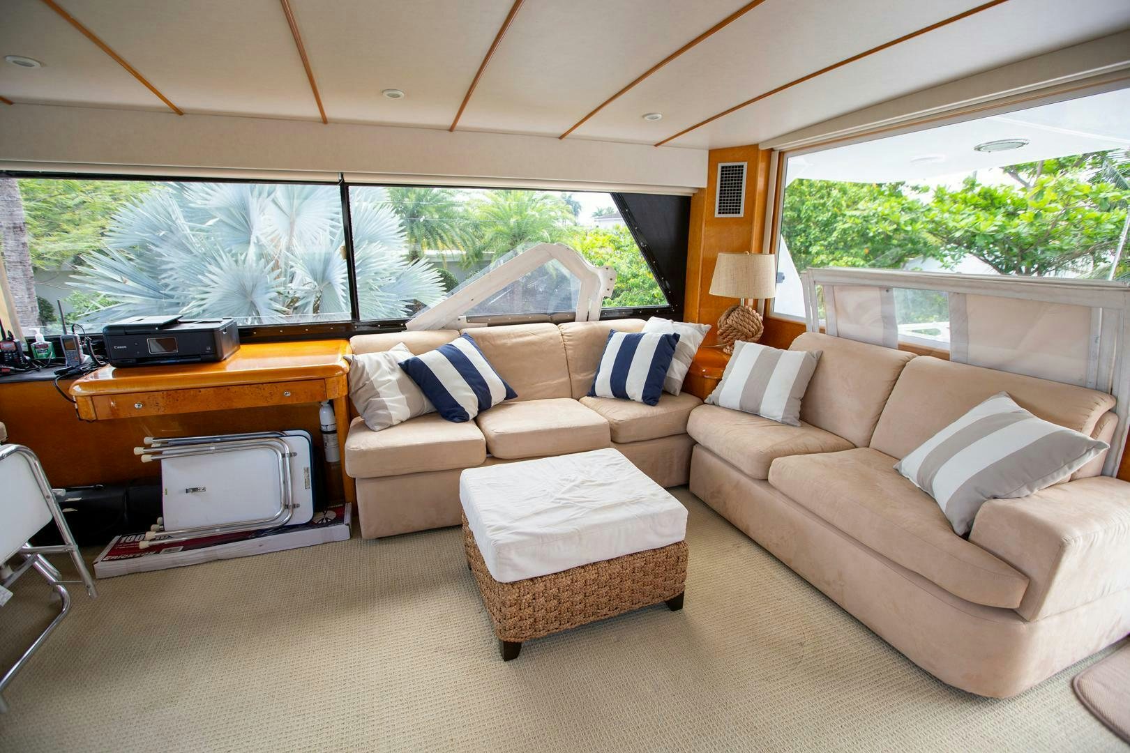 a living room with a couch and a tv aboard PAINKILLER Yacht for Sale