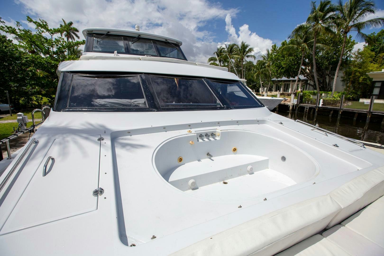 a white boat with a white roof aboard PAINKILLER Yacht for Sale