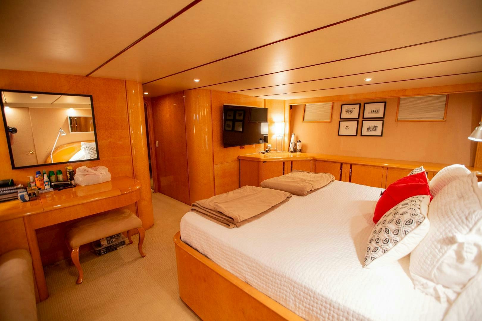 a hotel room with a bed and a desk aboard PAINKILLER Yacht for Sale