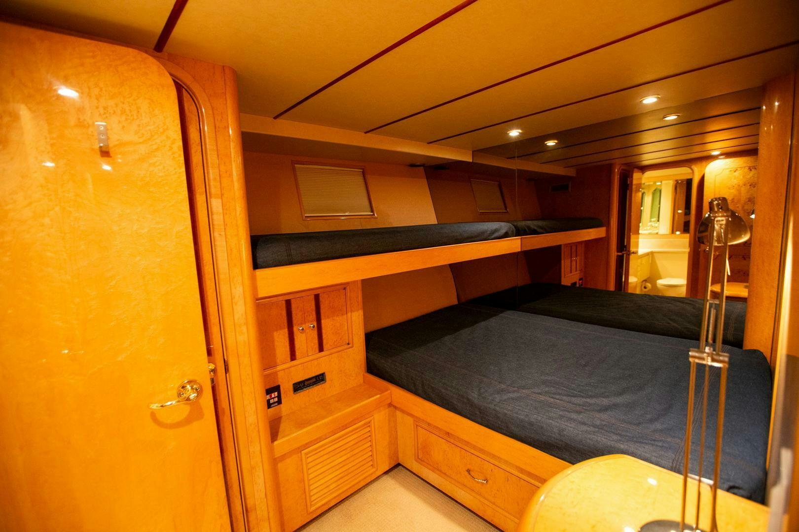 a bed in a room aboard PAINKILLER Yacht for Sale
