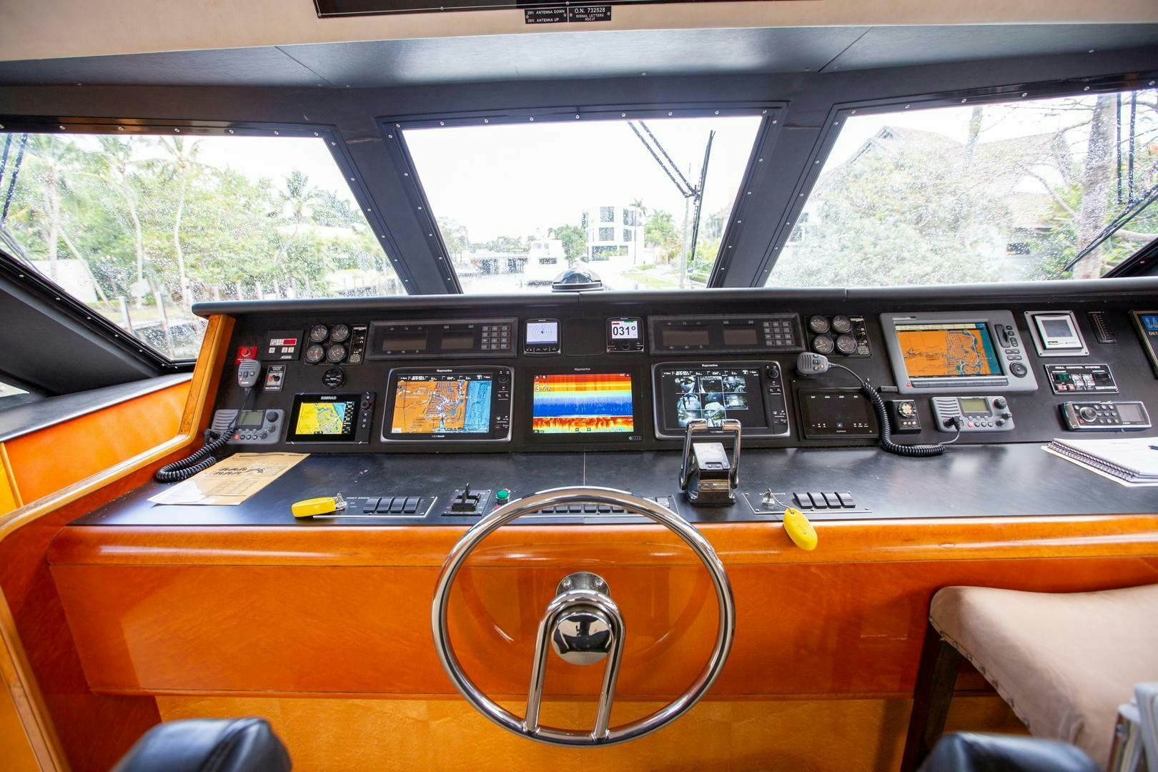 inside of a vehicle with a steering wheel and controls aboard PAINKILLER Yacht for Sale