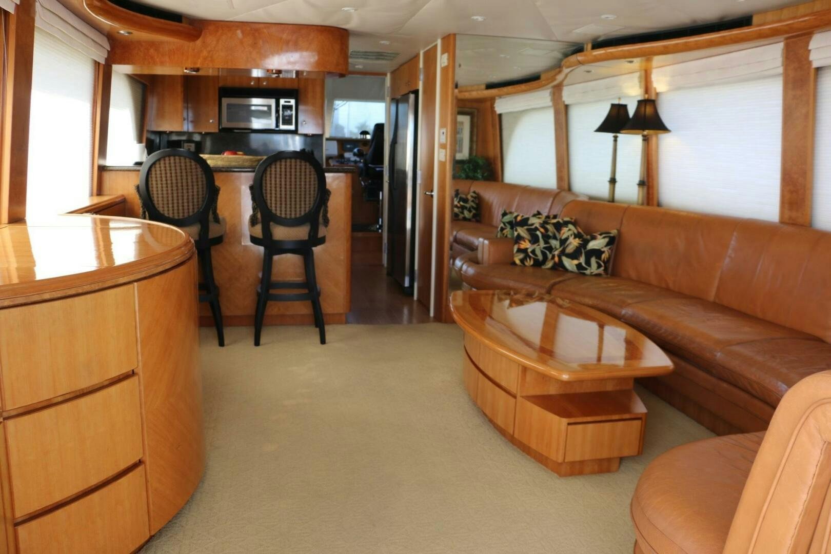 a living room with a couch and a table aboard RECYCLING MADE CENTS Yacht for Sale