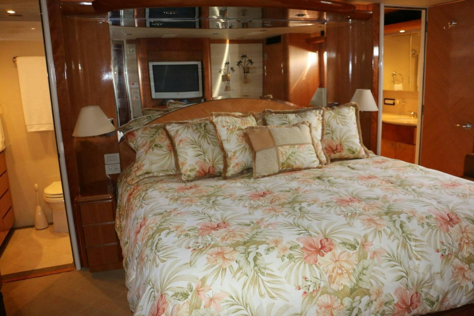 a bed with a white comforter aboard RECYCLING MADE CENTS Yacht for Sale