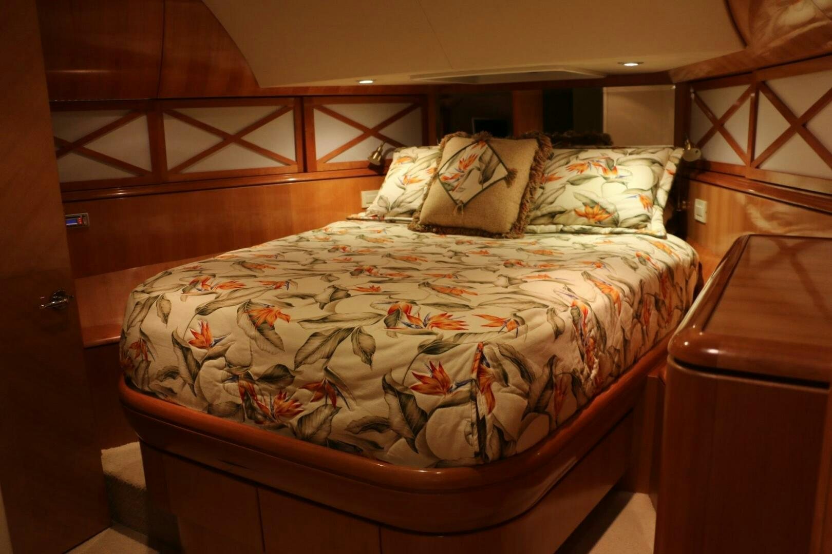a bed with a painting on the wall aboard RECYCLING MADE CENTS Yacht for Sale